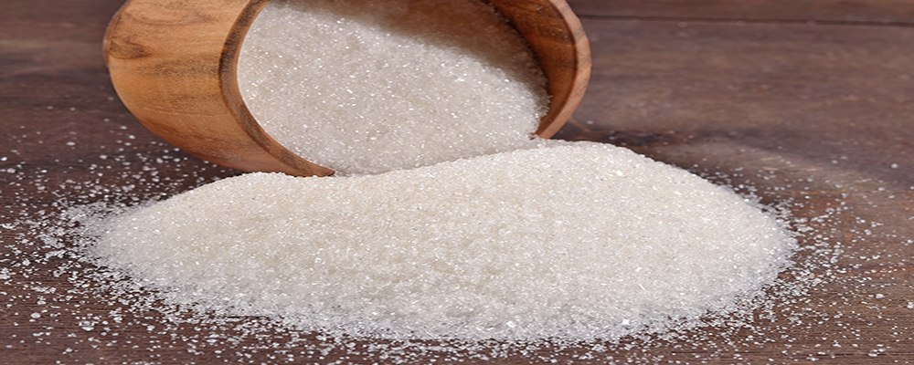 White sugar in a wooden bowl